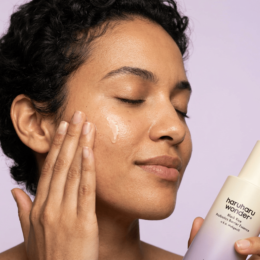 Model Nadia applying toner — HARUHARU WONDER Black Rice Probiotics Barrier Essence