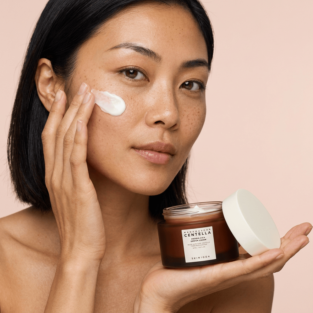 Model Mei pressing cream dots into her cheek — SKIN1004 Madagascar Centella Probio-Cica Enrich Cream