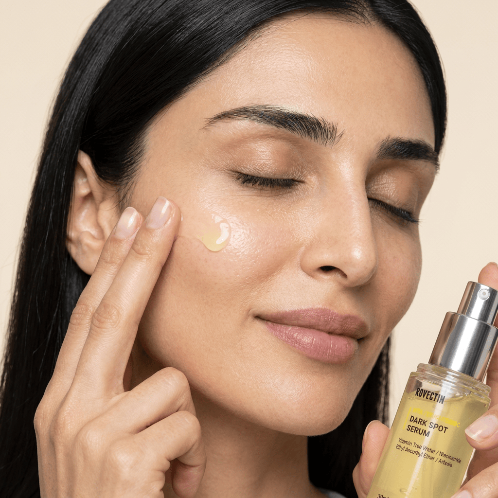 Model Yasmin applying serum with a glass dropper — ROVECTIN Vita Dark Spot Serum